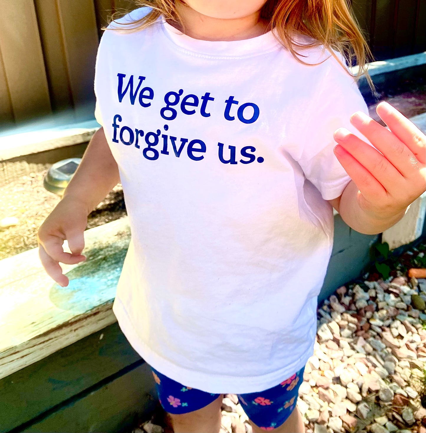 We get to forgive us.™ (toddler white tee)